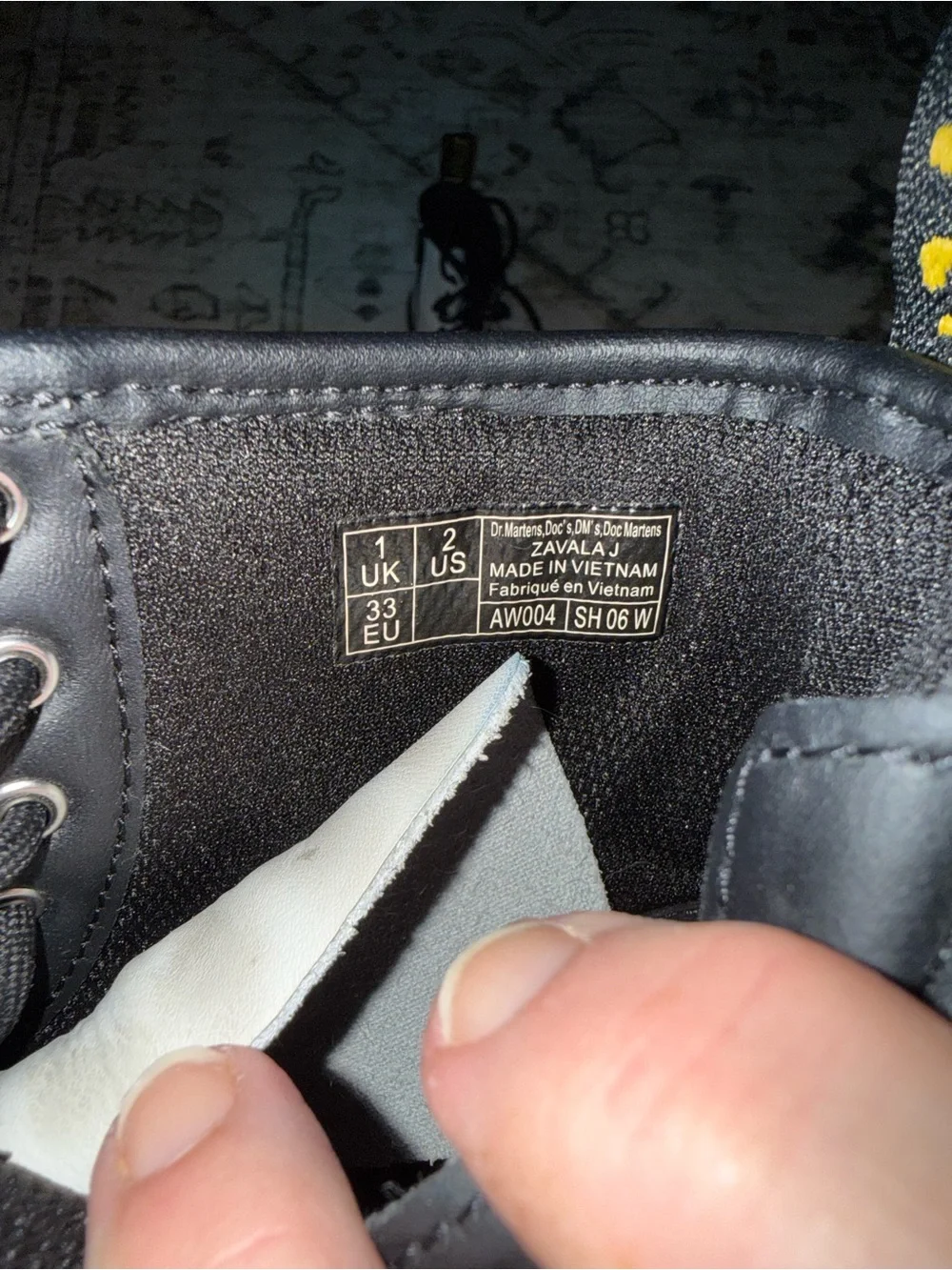 Dr. Martens Black and White Lace-Up Boots with Yellow Heel Loop